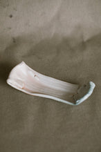 Load image into Gallery viewer, A wood fired platter on a beige fabric background. This wheel thrown stretched platter is made from white Australian stoneware clay with pale green ash on one end and light peach flashing on the other.