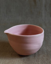 Load image into Gallery viewer, Pink ceramic matcha bowl on a textured brown surface