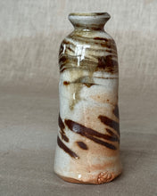 Load image into Gallery viewer, Woodfired ceramic bud vase with brown and white marbled clay with wood ash on a neutral background