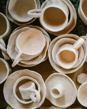 Load image into Gallery viewer, white pottery that has been bisque waiting for glaze. 